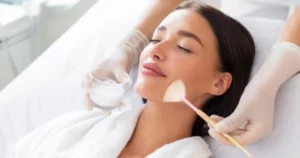 A woman in Riverside, CA receiving a professional CHEMICAL PEELS facial treatment